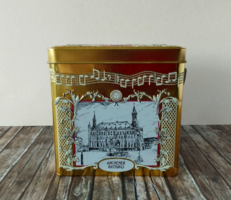 A beautiful gold-colored German tin music box