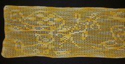 Crochet tablecloth with yellow and white highlights
