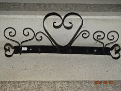Old decorative wrought iron wall hanger