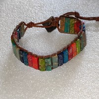 Used leather bracelet in good condition with mineral plates