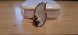 Half a pair of antique silver earrings with mother-of-pearl inlay