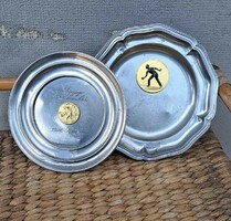 2 pewter bowls with sports medals.