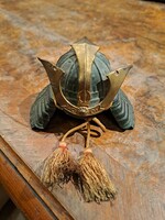 A miniature replica of a samurai kabuto helmet