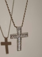 A beautiful silver chain with a large silver cross