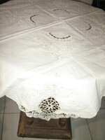 Beautiful crocheted rosette tablecloth with floral embroidery