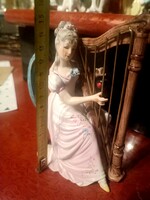 Harp playing lady