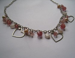 Silver necklaces with precious stones and hearts