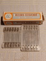 Record syringe in box with injection needles