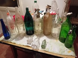A collection of bottles and soda with inscriptions
