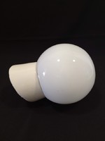 Old porcelain socket wall lamp with glass sphere cover