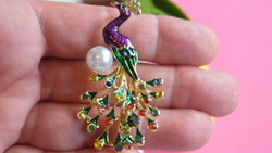 Fire enamel peacock brooch with pearls.