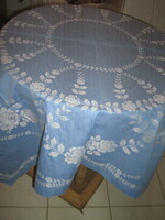 Beautiful vintage blue damask tablecloth with white flowers