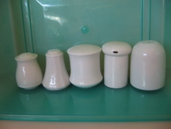 White salt shakers in pieces