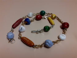 Old retro necklace made of glazed porcelain beads in beautiful colors