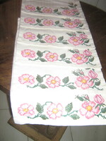 Small tablecloth napkin embroidered with charming small cross stitch flowers