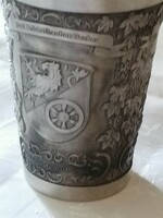 Richly decorated pewter cup with markings
