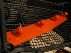 Retro orange red plastic wall hanger
