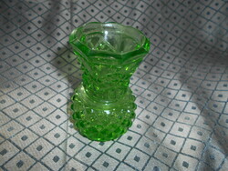 Retro glass vase with beautiful bright green violet color