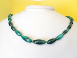 Malachite natural mineral chain of cylindrical grains