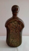 A very nice brandy bottle with three cups.
