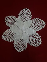Crochet lace tablecloth in the shape of a flower