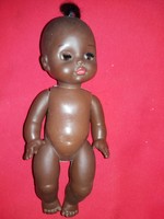 Antique nutmeg numbered black plastic toy doll 26 cm in nice condition according to the pictures