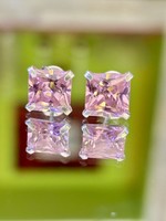 Pair of shiny silver earrings, embellished with pink zirconia stones