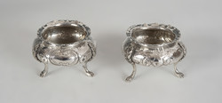 Pair of silver spice racks with stylized lion legs