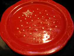 Red plate with dots and butterfly