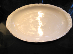 Oval white porcelain serving bowl with convex flowers