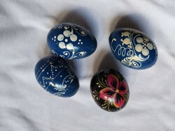 Four wooden hand-painted eggs