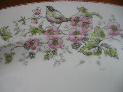 An antique meat dish with birds is on the way