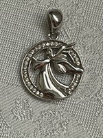Very nice silver guardian angel pendant surrounded by shock small stones.