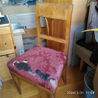 A pair of very old chairs with horsehair seats to be renovated.