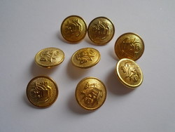 8 Pcs. New gold colored metal buttons.