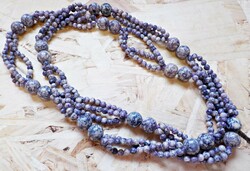 A special string of old purple glass beads