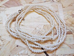 Multi-row white plastic tekla beads