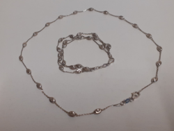Necklace with three-row bracelet made with intricately engraved patterned eyes in silver