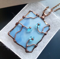 Beautiful light blue glass pendant with sparkling blue pearls