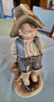 Porcelain figurine of a boy in a hat