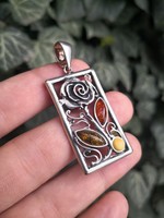 Beautiful, rosy silver pendant with amber stones