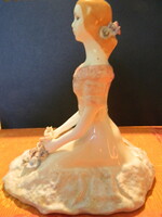 Romanian porcelain: seated girl with flowers.