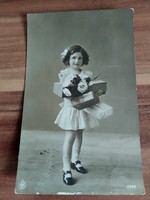 Antique photo postcard, little girl with gifts, 1913
