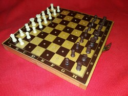 Old traveling chess set with pieces with 
