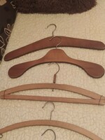 9 old wooden hangers!