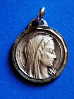 Old silver-plated medal of the Holy Virgin of Lourdes