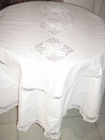 Beautiful antique oval linen tablecloth with hand-crocheted inserts and edges