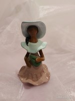 Girl in ceramic hat.