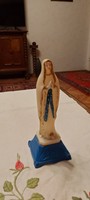 Old plastic statue of the Holy Virgin Mary, home altar