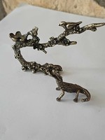 Copper mini sculptures of birds on tree branches and crocodiles